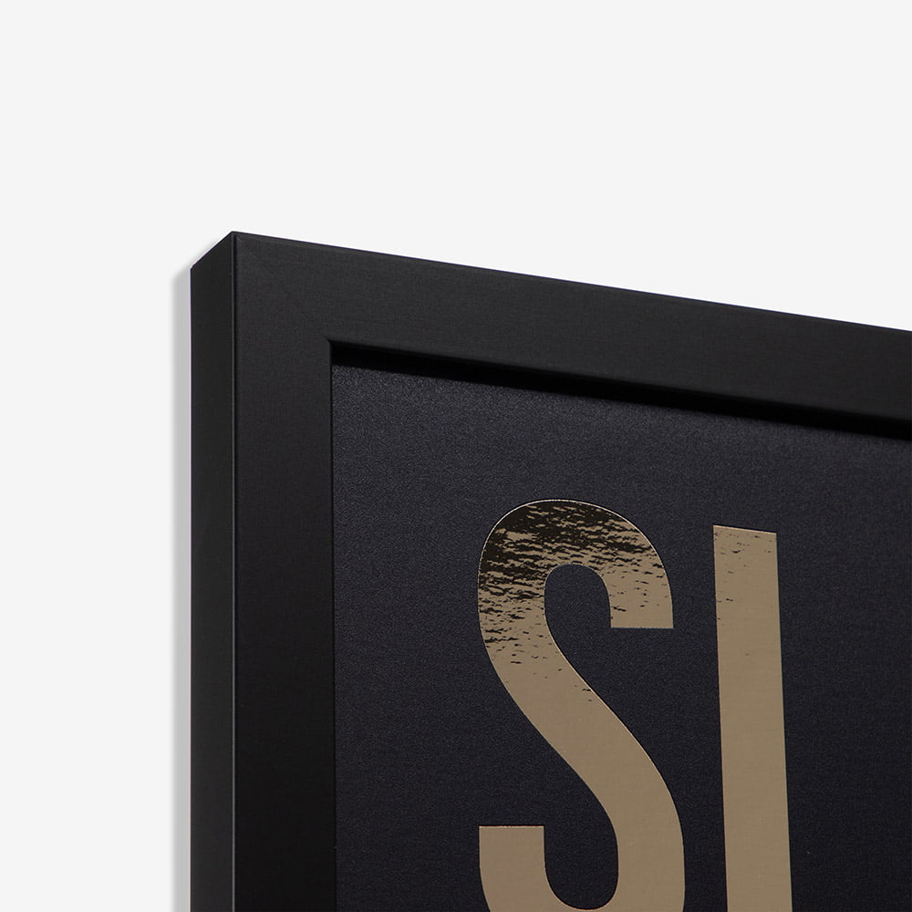 Corner detail of a metallic foil framed print